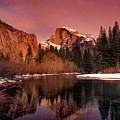 winter sunset lights up half dome yosemite national park